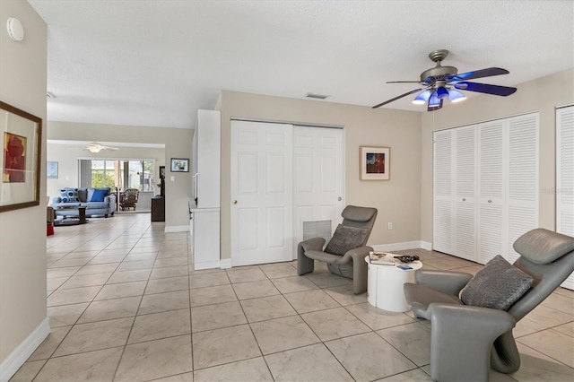 sitting room featuring light tile patterned floors and a textured ceiling