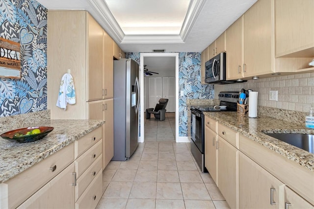 kitchen featuring light tile patterned floors, ceiling fan, stainless steel appliances, light brown cabinets, and light stone countertops