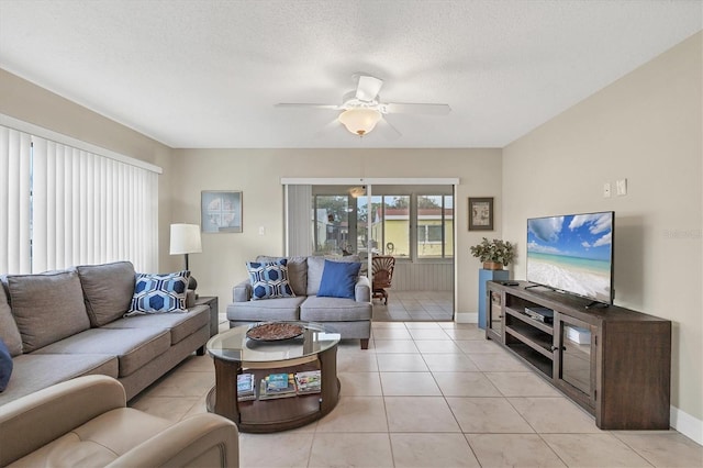 tiled living room featuring a textured ceiling and ceiling fan