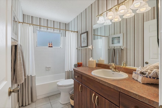 full bathroom featuring toilet, shower / tub combo with curtain, tile patterned flooring, a textured ceiling, and vanity