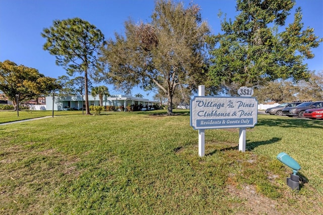 view of property's community with a yard