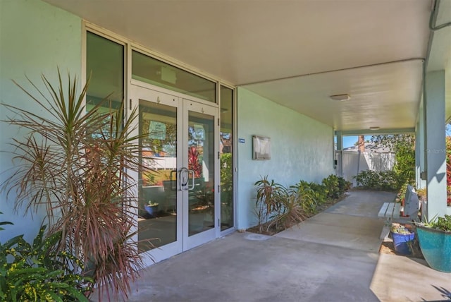 view of exterior entry featuring french doors