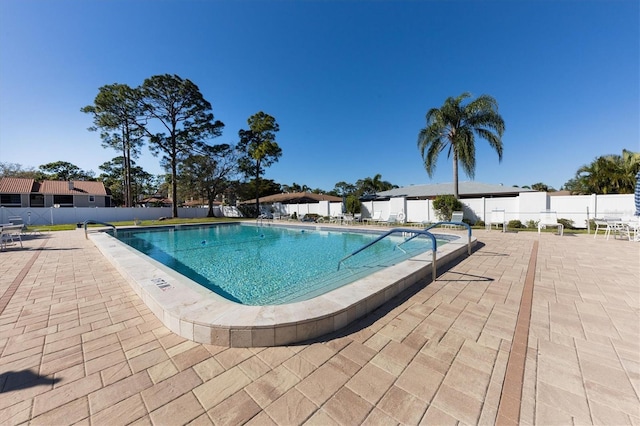 view of swimming pool with a patio