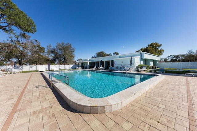 view of swimming pool with a patio area