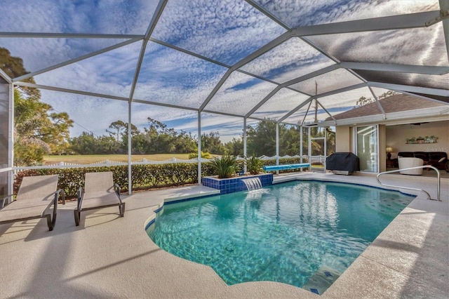 view of swimming pool with area for grilling, a lanai, a patio area, and pool water feature