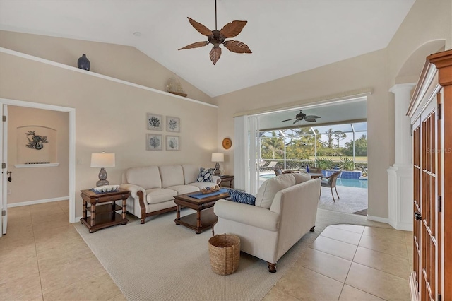 living room with light tile patterned flooring, ceiling fan, and lofted ceiling