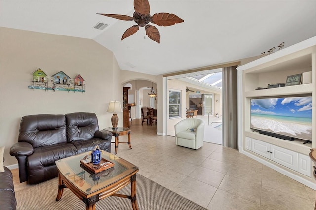 tiled living room featuring lofted ceiling and ceiling fan