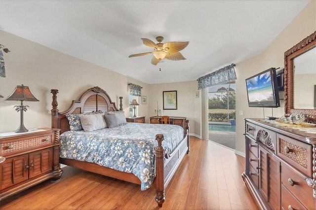 bedroom featuring access to exterior, ceiling fan, and light wood-type flooring