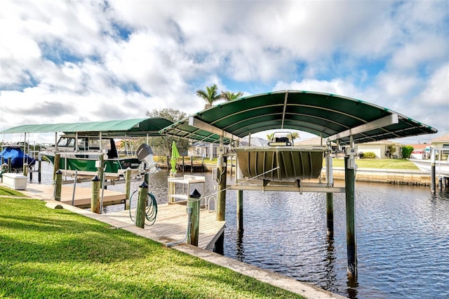 dock area featuring a water view and a lawn