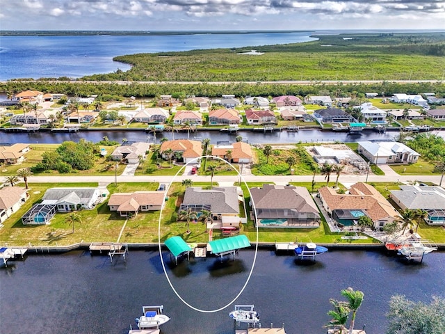 bird's eye view with a water view