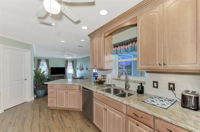 kitchen with light brown cabinets, sink, backsplash, kitchen peninsula, and stainless steel dishwasher