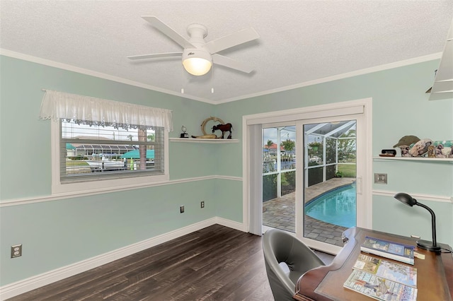 office space with a textured ceiling, crown molding, dark hardwood / wood-style flooring, and a healthy amount of sunlight