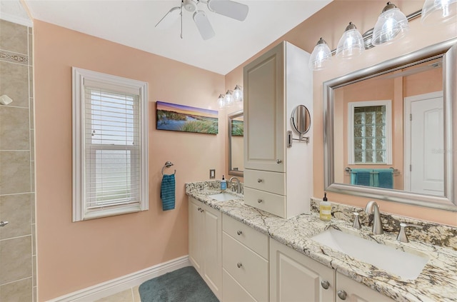 bathroom with ceiling fan, vanity, and tile patterned flooring