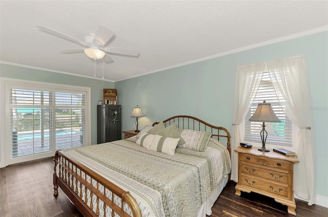 bedroom with ceiling fan, dark wood-type flooring, a textured ceiling, and ornamental molding