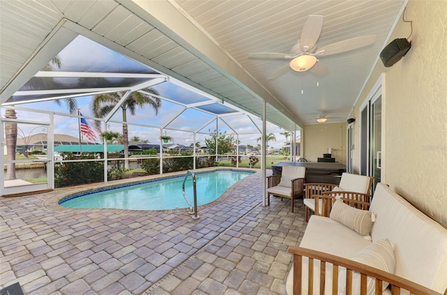 pool featuring ceiling fan, a lanai, a patio area, and an outdoor living space
