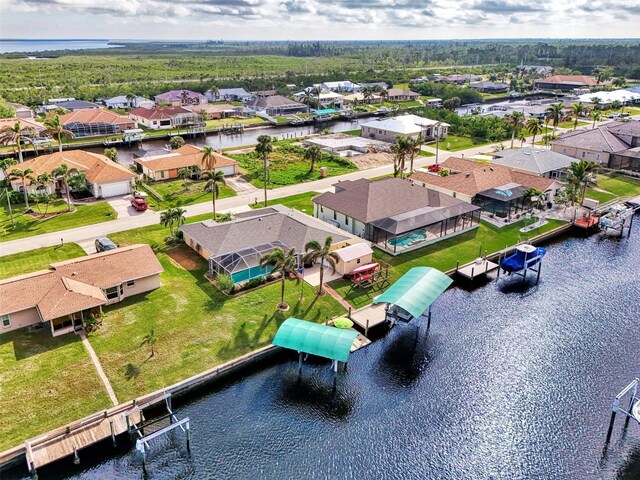 bird's eye view featuring a residential view and a water view