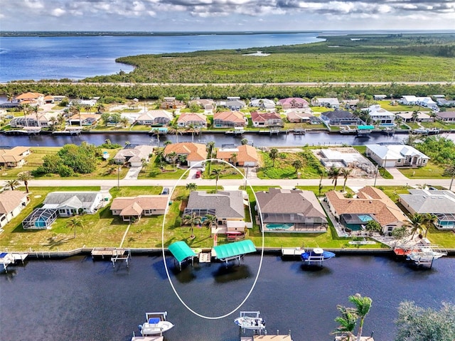bird's eye view with a water view and a residential view