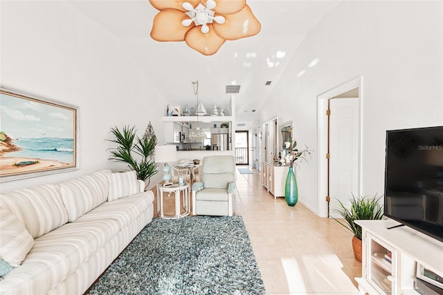 tiled living room with high vaulted ceiling