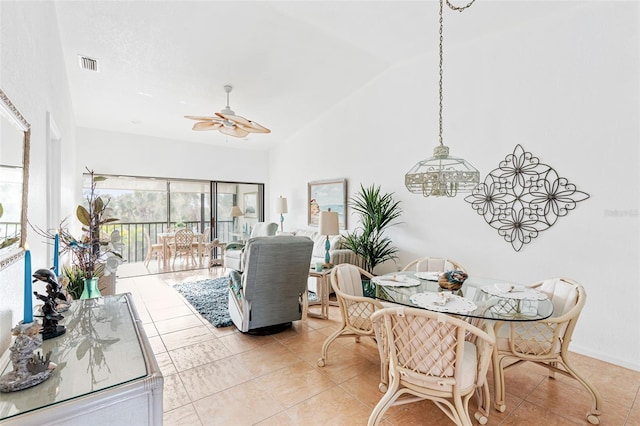 dining room featuring light tile patterned floors and ceiling fan with notable chandelier