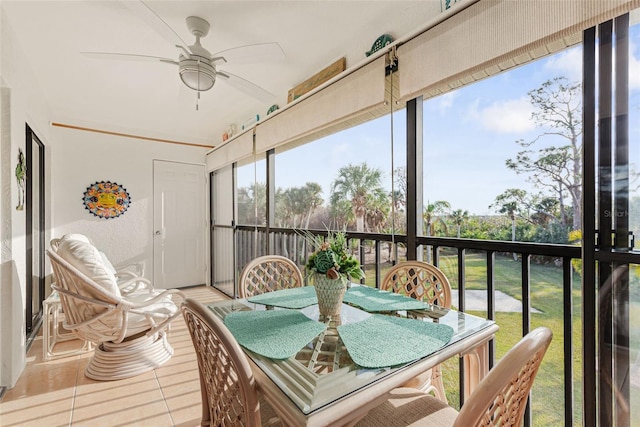 sunroom / solarium with ceiling fan and a healthy amount of sunlight