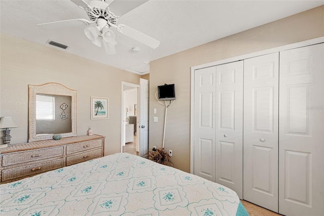 bedroom featuring ceiling fan and a closet