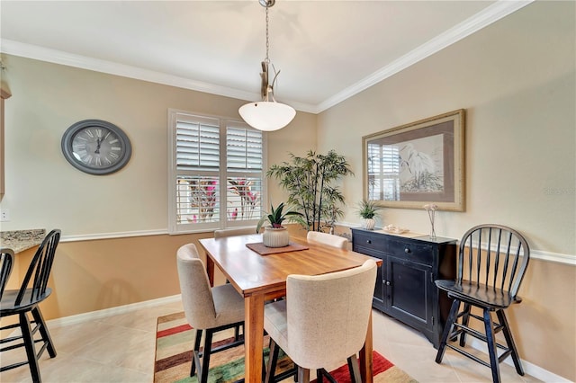 tiled dining space featuring crown molding