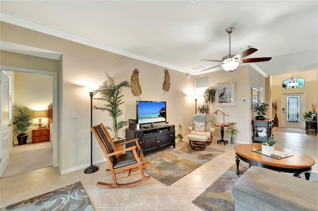 living room featuring ornamental molding, lofted ceiling, light tile patterned floors, and ceiling fan