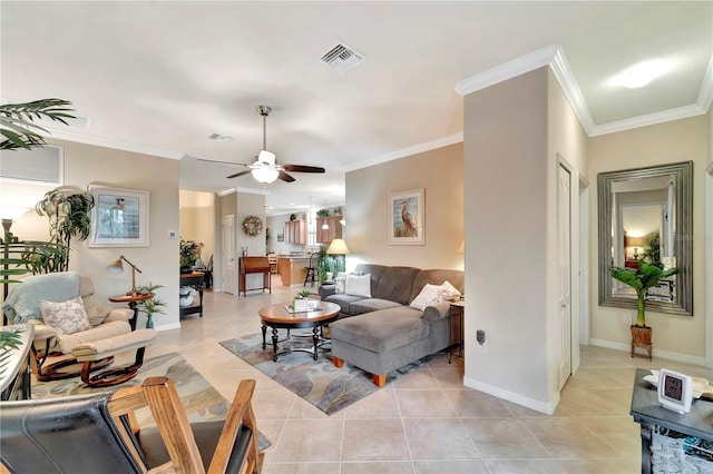 living room with crown molding, ceiling fan, and light tile patterned floors