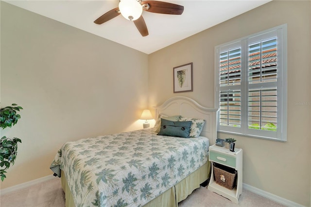 bedroom with light carpet and ceiling fan