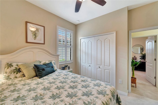 bedroom with light carpet, a closet, and ceiling fan