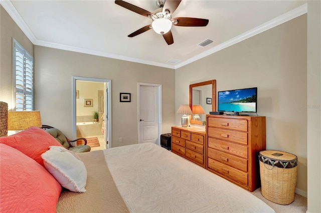 carpeted bedroom with ceiling fan, ensuite bathroom, and ornamental molding