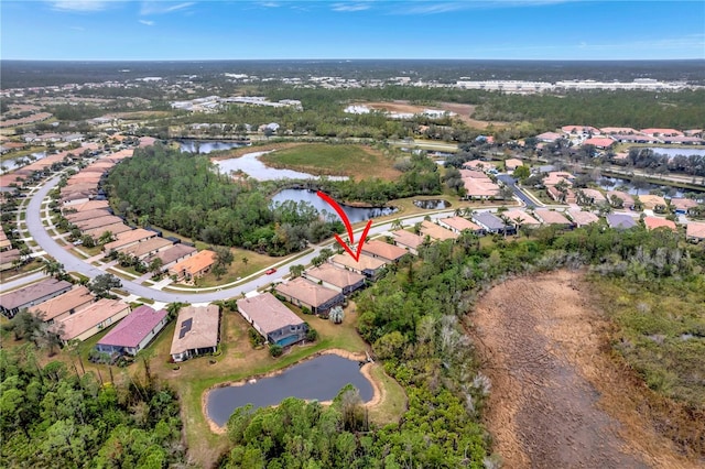 birds eye view of property featuring a water view