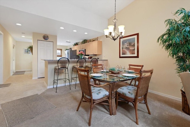 dining area with an inviting chandelier