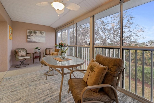 sunroom / solarium featuring ceiling fan and lofted ceiling