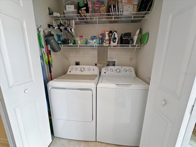 laundry area with washing machine and clothes dryer