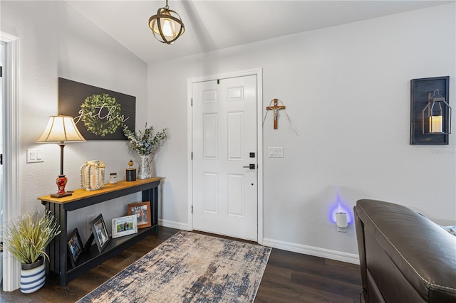 foyer with dark hardwood / wood-style floors