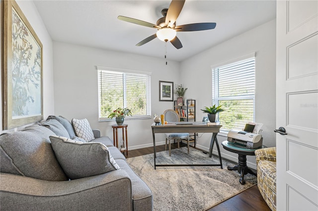 office with hardwood / wood-style flooring and ceiling fan