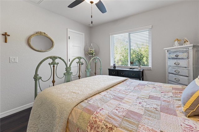 bedroom with dark hardwood / wood-style flooring and ceiling fan