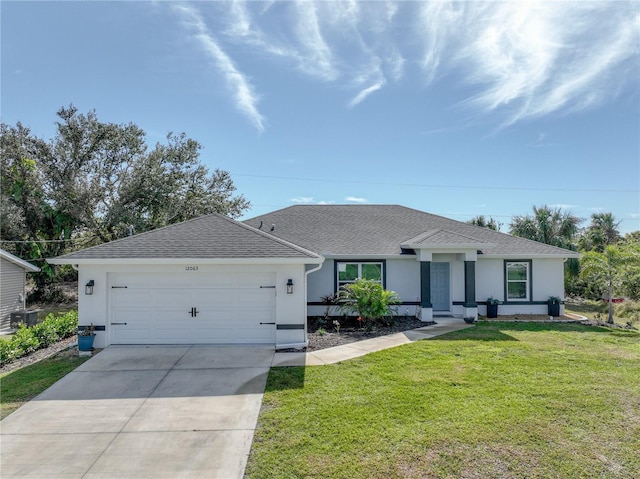 ranch-style home with a garage, a front yard, and central air condition unit