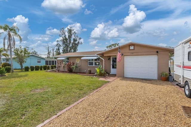 single story home with a front lawn and a garage