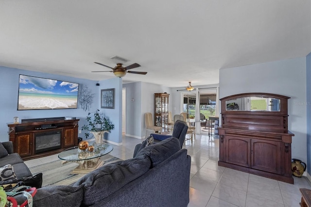 tiled living room featuring ceiling fan