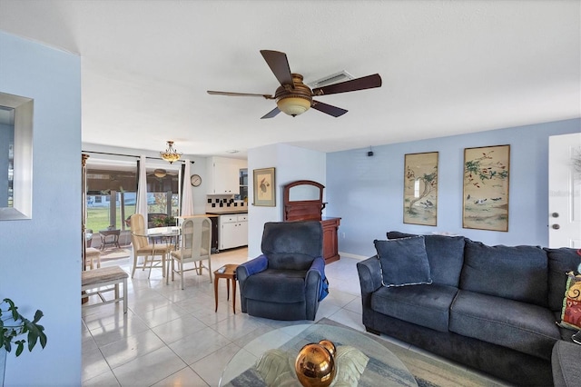 tiled living room featuring ceiling fan