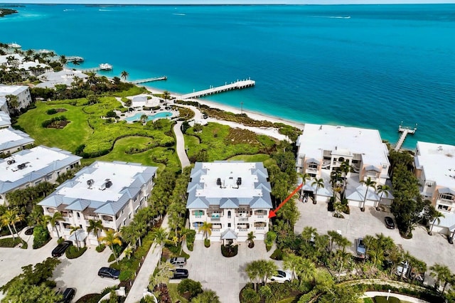 drone / aerial view with a water view and a view of the beach