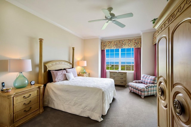 carpeted bedroom with ceiling fan and ornamental molding