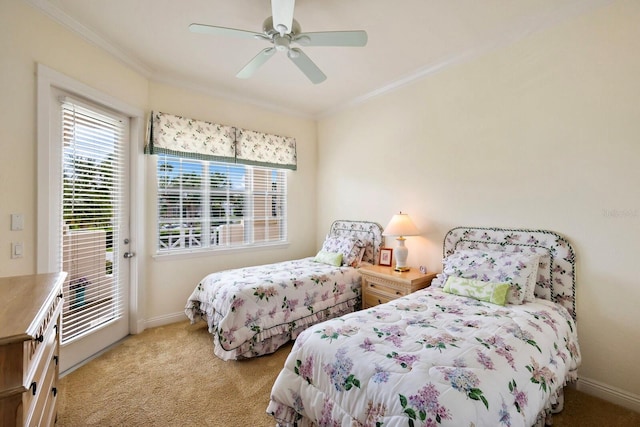 bedroom featuring light colored carpet, ceiling fan, and ornamental molding