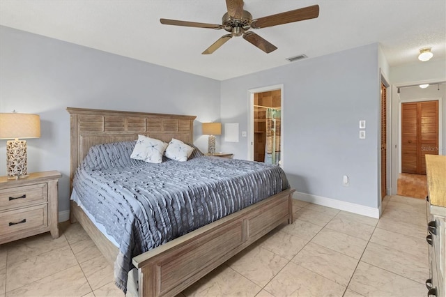 bedroom with connected bathroom and ceiling fan