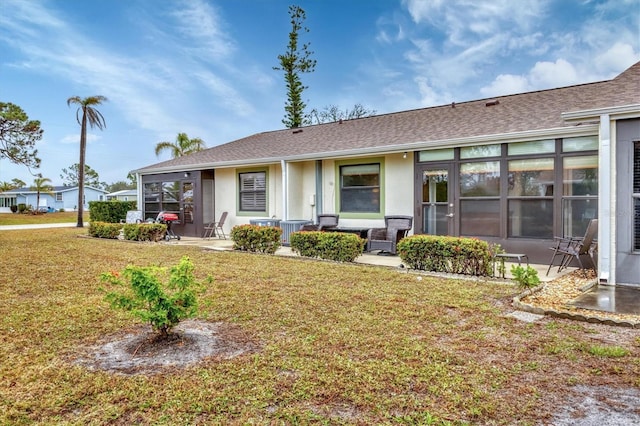 view of front of house featuring a front yard and central air condition unit