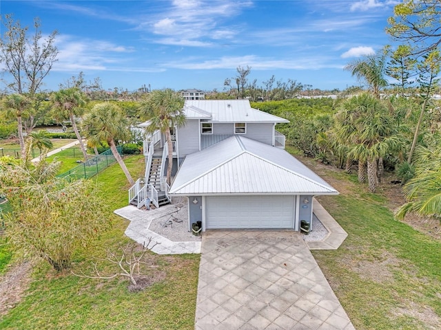 view of front of house with a front lawn and a garage