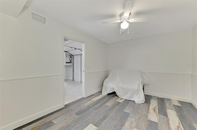 interior space with ceiling fan and hardwood / wood-style floors