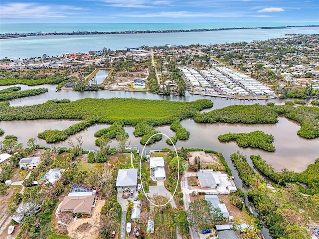 birds eye view of property featuring a water view